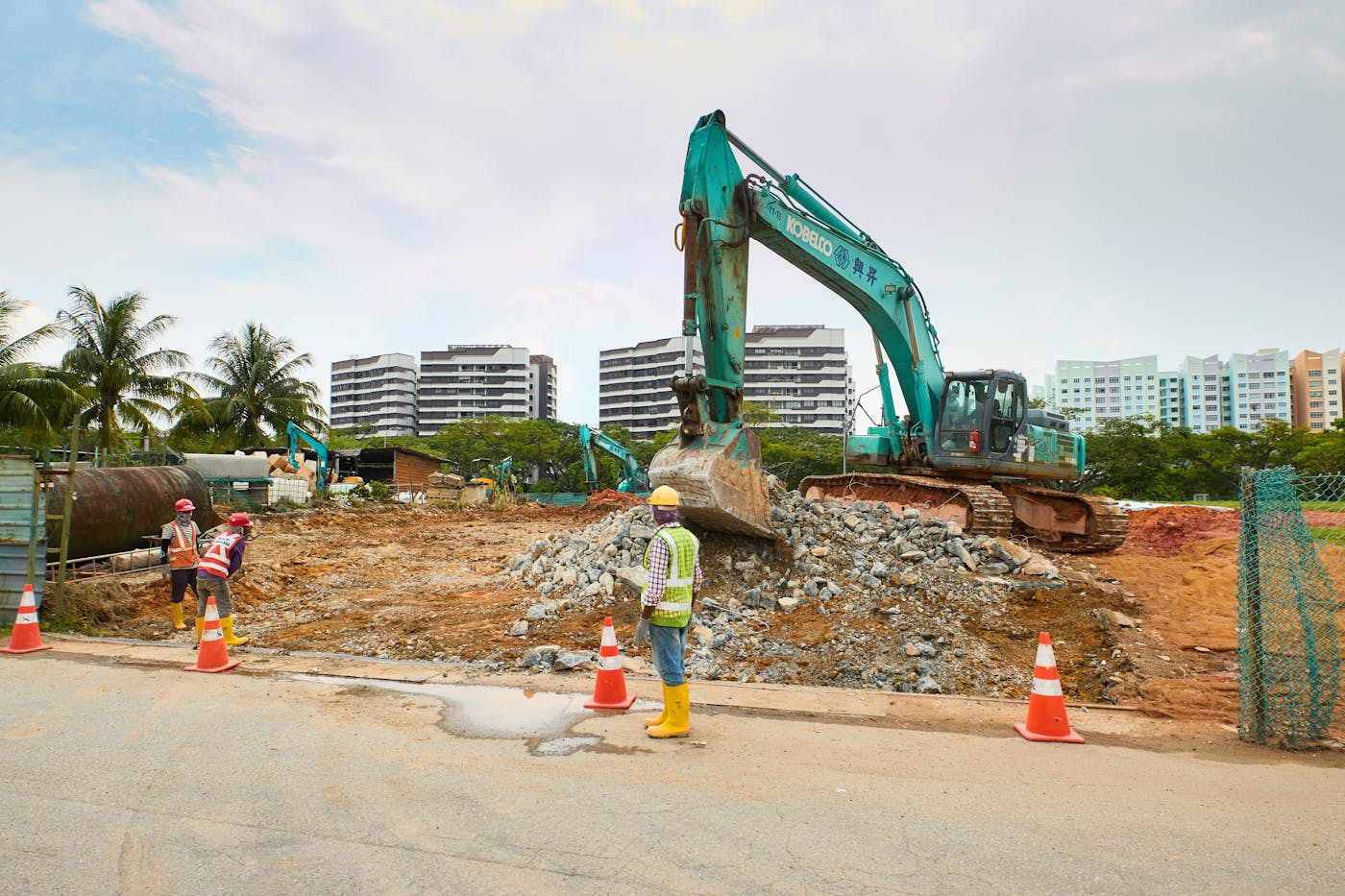 Earthworks and drainage machinery preparing a Perth site for outdoor works